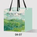 Green paper gift bag with Van Gogh art print and black handles, ideal for flower packaging. - Style 07 Green