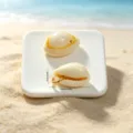 Detailed view of two ocean style shell pendants with dimensions shown in cm and inches - Natural Cowrie Shell Pendant