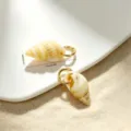 Detailed view of natural conch shell charms with gold loops and dimension markings - Natural Fine Vein Beige Conch