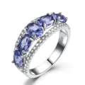Eleganter 925 Silber Ring mit ovalen lila Edelsteinen und funkelndem Pavé-Besatz. - Größe 5 / Nano-Tansanit