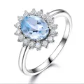 S925 Sterlingsilber hellblauer ovaler Edelstein Blumen Halo Ring Variante Schmuck - Größe 5 / Himmelblau