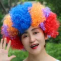 Colorful clown afro wig for Halloween party, voluminous curly hair variant style D 130g. - One Size / Style D