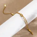 Gold double strand snake chain bracelet with elegant knot design for women and girls daily wear. - Double Layer Knot Snake Chain / Gold