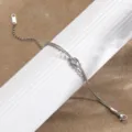 Silver double snake bone chain bracelet with a knot design, stylish titanium steel jewelry. - Double Layer Knot Snake Chain / Steel