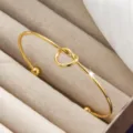 Goldener Titanstahl Knoten offener Armreif, minimalistischer modischer 18k vergoldeter Schmuck. - Doppelperlen-Stil (szkk031) / Gold