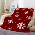 Detailed view of Christmas red flannel throw blanket with white snowflakes draped on cozy sofa. - ZM20250827-2 / 70x100 Single-Sided Print (230g/㎡ Flannel)