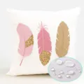 Detailed closeup view of the waterproof pink and gold feather pattern cushion cover fabric. - ZB2026725-8