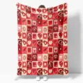 Dettaglio coperta in flanella con cuori, motivo a quadri rossi e beige per un arredo accogliente. - 70x100 (Flanella 230g/㎡) / ZM20251220-1