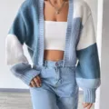 Detailed view of the stylish color-block knitted cardigan, showing unique sleeve pattern. - S / Sky Blue
