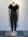 Detailed view of the black feather strapless jumpsuit featuring dazzling rhinestone lines. - S / Black