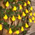 Solar gourd string lights with green leaves ivy vine decor for outdoor patio garden lighting. - 5m 20 Lights - Solar 8 Modes / Yellow Gourd