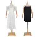 Detail view of women two piece lace dress with black slip inner wear on mannequin display. - L / White with Camisole