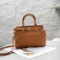 Genuine leather tote bag for women, stylish brown top-handle crossbody handbag with belt detail. - Caramel color