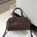 Detail view of dark brown cowhide Boston bag, stylish soft leather handbag & crossbody. - 25-12-15cm / Coffee