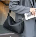 Genuine leather shoulder bag for women, stylish pillow crossbody bag with soft texture. - Black