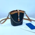 Bolso cubo de cuero negro y marrón con correa de cadena, diseño bicolor de moda para mujer. - Negro