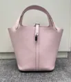Detailed view of the pink leather bucket bag, crafted with premium cowhide and silver hardware. - Dreamy Pink Purple with Silver Buckle