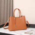 Premium leather tote bag for women, large capacity shoulder handbag with stylish charm. - Brown