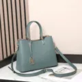 Premium cowhide leather tote bag in blue-gray, stylish crossbody handbag with metal charm. - Pearl Blue