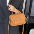 Stylish women leather messenger bag with top handle and shoulder strap for daily casual wear. - 23*8*16CM / Caramel color