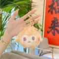 Detailed shot of a cute fluffy plush sheep keychain with soft curly fur and a gold ring. - Orange (Gold Clasp)