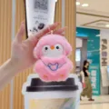 Cute pink plush animal doll keychain pendant with embroidery details, soft toy accessory. - Pink Penguin with Headphones