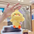 Cute fluffy yellow duck plush keychain, soft toy with mini camera bag and flower hair clip. - 13cm Standard Chain / Purple Camera