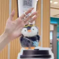 Cute chubby penguin plush keychain with mini camera pendant, soft stuffed animal bag charm. - With Blue Camera