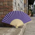 Solid purple folding fan with natural bamboo ribs for DIY crafts and wedding favors - Style P No.15 Hollow Carved Colored Paper Fan (Dark Purple)
