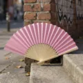 Pink folding fan with bamboo ribs on stone steps for wedding favors or DIY crafts - Style R Plain Satin Fan (Pink)