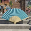 Handheld light blue folding fan with natural bamboo ribs for DIY crafts and wedding favors - Style Q No.7 - Smooth Colored Fan (with Border) / Lake Blue
