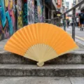 Classic orange silk folding fan with natural bamboo ribs for weddings and DIY crafts. - Style Q No.9 - Smooth Colored Fan (with Border) / Orange