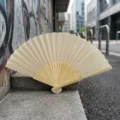 Minimalist blank cream folding fan with bamboo ribs for DIY wedding favors and crafts - Style Q No.11 - Smooth Colored Fan (with Border) / Beige