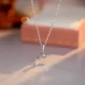Exquisite zircon goblet wine glass pendant necklace detail close-up showcasing fine jewelry craft. - Silver