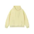 Solid color fleece pullover hoodie in light yellow, comfortable oversized fit with adjustable draw. - Beige
