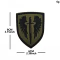 High quality embroidered tactical patch with dark wings and sword design for backpacks and clothing. - Holy Sword Wings (Green and Black)