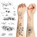 Detail view of black floral temporary tattoo stickers, showing sheet layout and arm application. - 10 Pieces/Pack / Black
