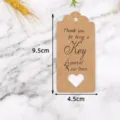 Etichette regalo in carta kraft con cuore intagliato, messaggio grazie, 9.5x4.5cm. - LH-326 / Confezione da 100 / colore pelle di mucca