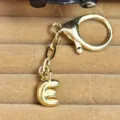 Gold bubble letter E keychain pendant copper plated bag charm cute fashion accessory pendant - Letter E