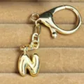 Gold bubble letter N keychain pendant, metal bag charm accessory for keys and handbags. - Letter N