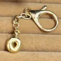 Gold plated letter O keychain pendant, elegant metal bag charm and key ring accessory. - Letter O
