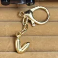 Gold-plated puffy letter keychain pendant, stylish bag charm and metal keyring accessory. - Letter V