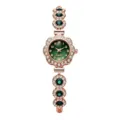 Detailed macro view of luxury women's green dial quartz bracelet watch with sparkling rhinestones - Rhinestone Emerald-Color Floral Bracelet Style / Green