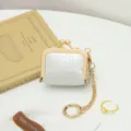 Mini PU leather kiss-lock coin purse and portable jewelry box for rings, necklaces, and small accessories. - Silver
