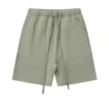 Casual sage green sweat shorts for men featuring elastic waist and long drawstrings. - S / Bottoms / Army Green