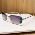 Metal rimless sunglasses with gradient lenses and trendy green leaf decorations for women. - Grey Orange