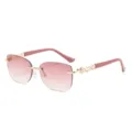 Schicke randlose, rosafarbene Sonnenbrille mit Perlen und goldenen Bügeldetails. - Goldener Rahmen / Doppelte rosa Gläser