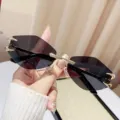 Trendy rimless polygon sunglasses with black lenses and gold metal corner details for women. - Rimless Polygon / Gold Frame Grey Lens