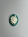 Green and white resin cameo charm featuring an elegant carved rose blossom design. - Lake Blue Base White Flower