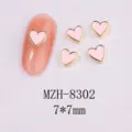 Detailed view of 7x7mm pink heart nail art charms with gold metal borders. - 8302 Gold Border Pink Marble (7x7mm)